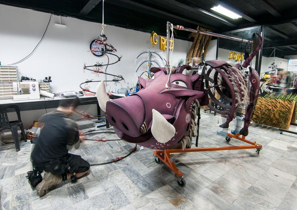 Tim Lucas does final touches on some insects beside the Pumba puppet | Photo by Lawrence Carlos