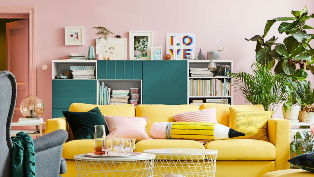 condoliving with gen z yellow sofa, white mesh coffee tables, and dark green wall unit.