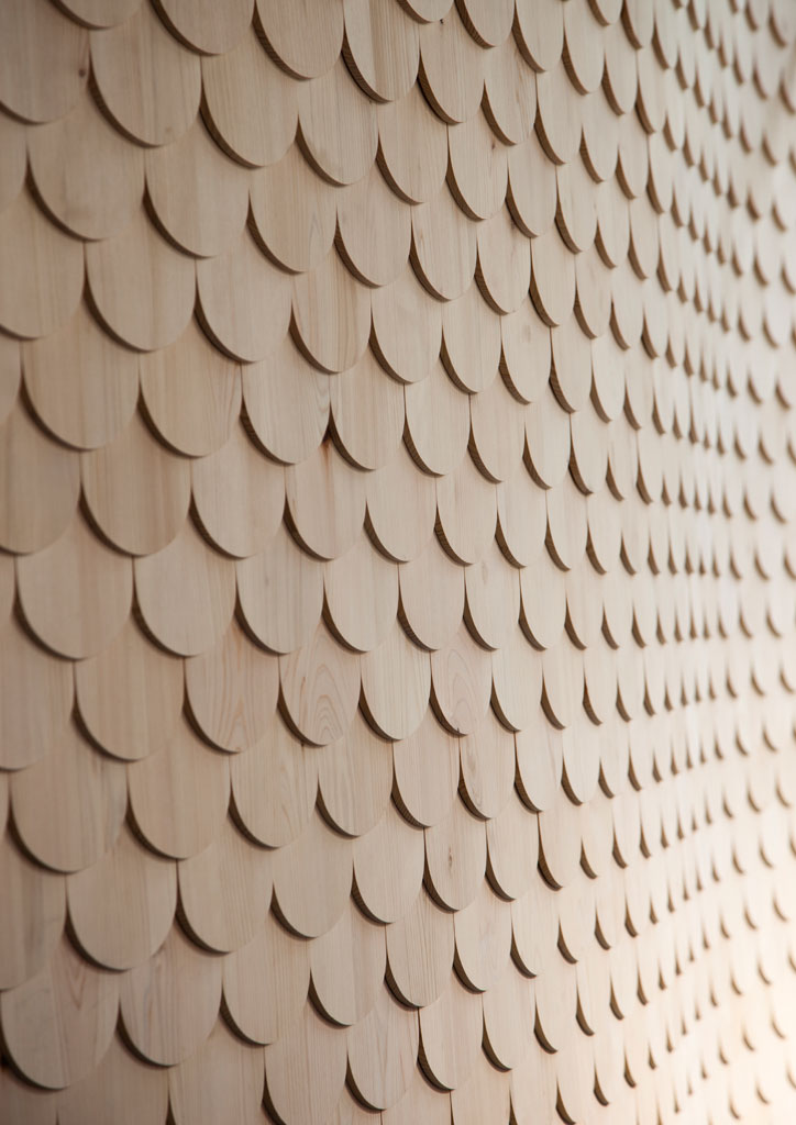 4,500 cypress tiles in the shape of fish scales make up the bar backdrop at Sushi Rei