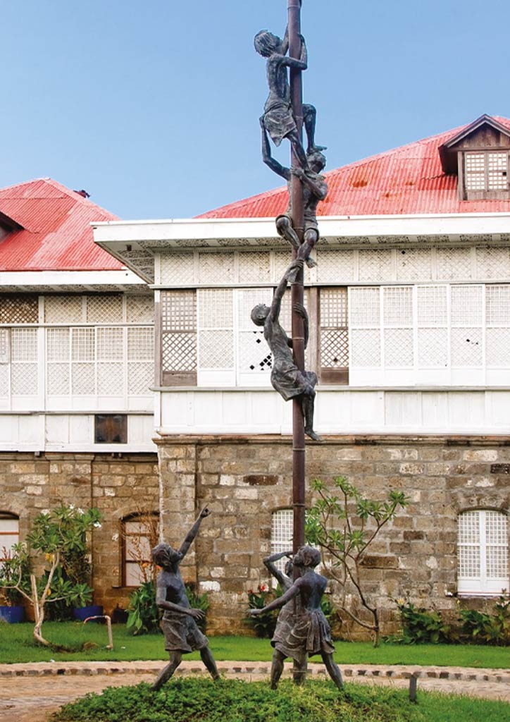 A playful life-sized depiction of children’s palo sebo at the heritage site