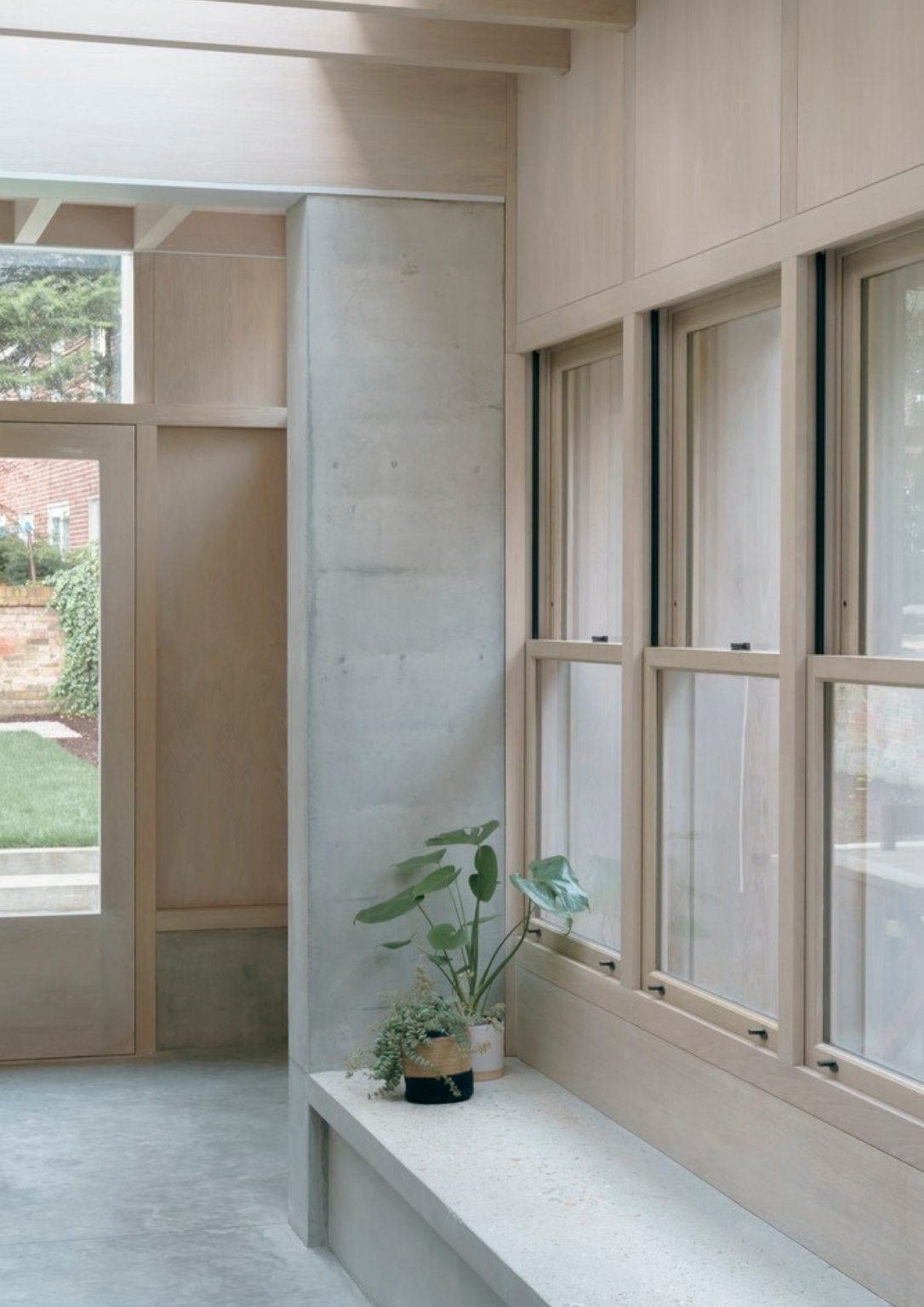 light wooden walls with paned windows