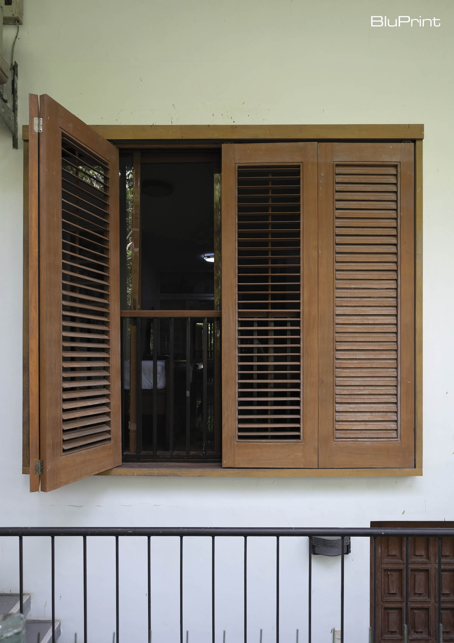 Slatted wooden window shutters