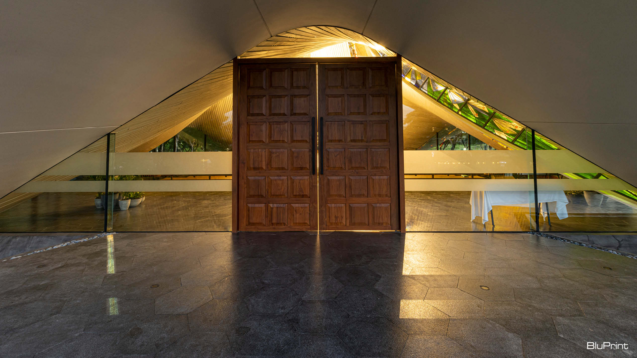 The wooden door of the Our Lady of Lourdes Chapel