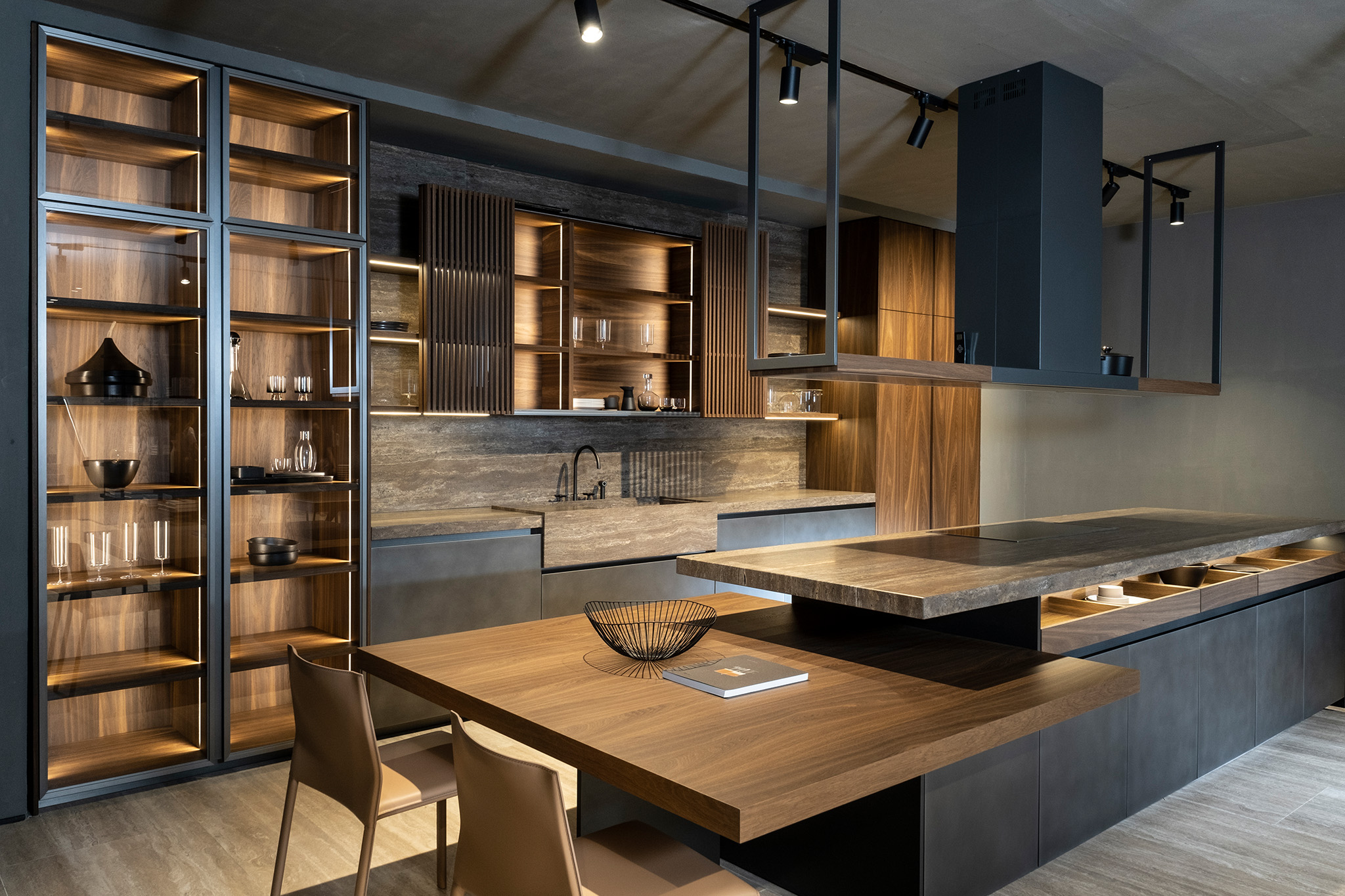A modern kitchen with wooden countertops and shelves with a mixture of stone and metal accents.