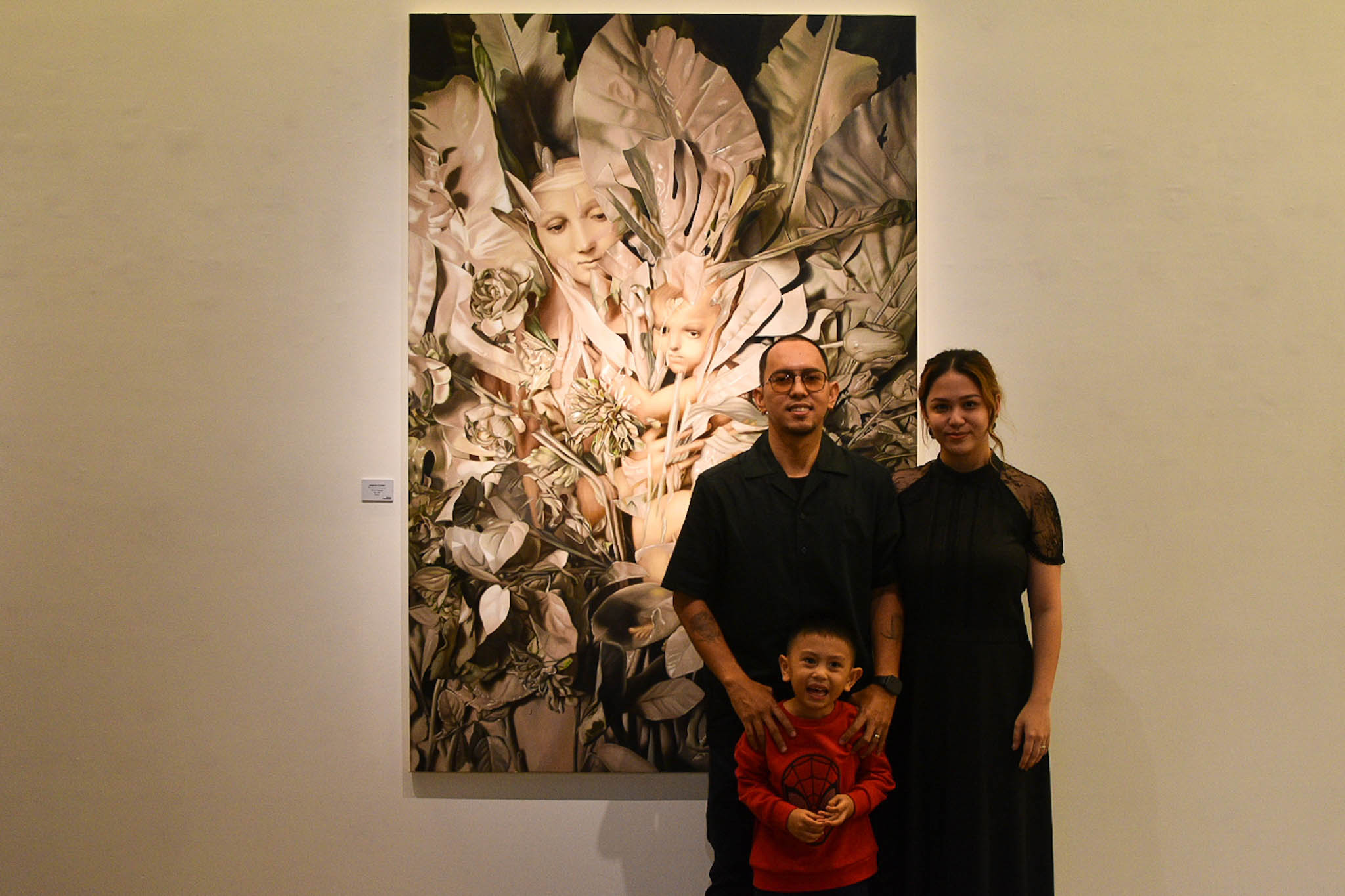 Artist Jayson Cortez with his wife and son