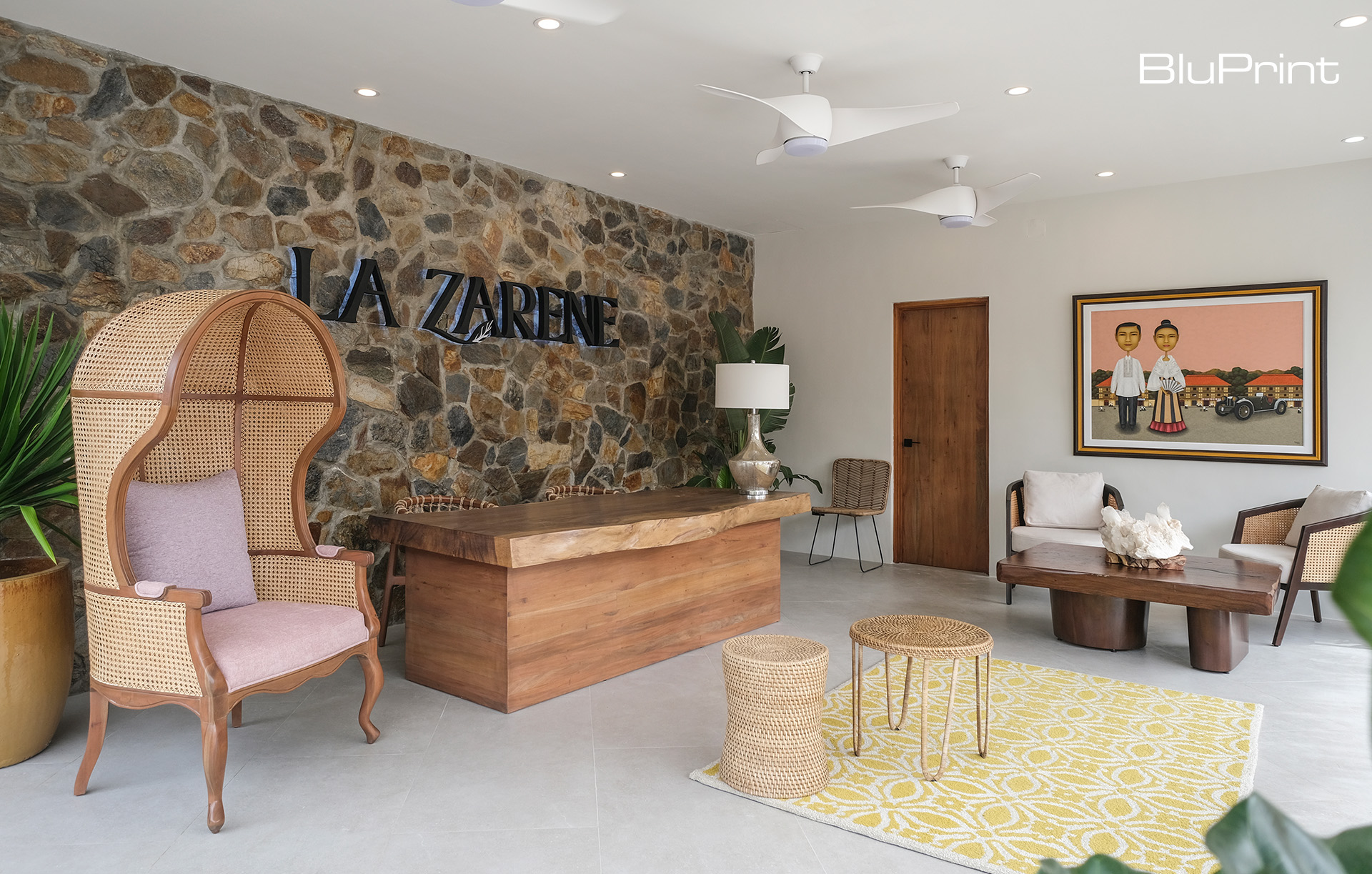 La Zarene's lobby with wood furntiure and rattan and stone fixtures.