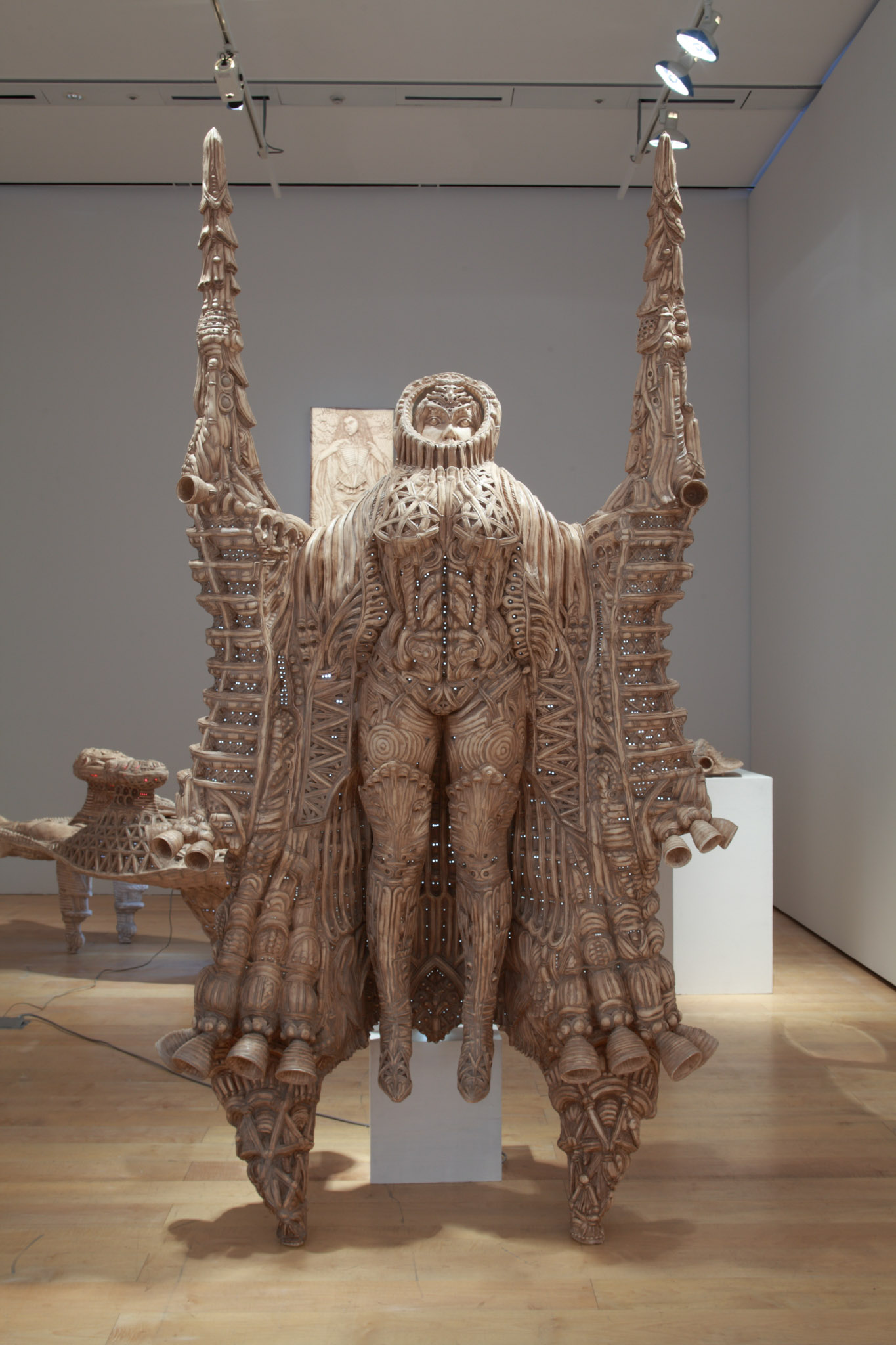 A life size sculpture depicting a person with wings.