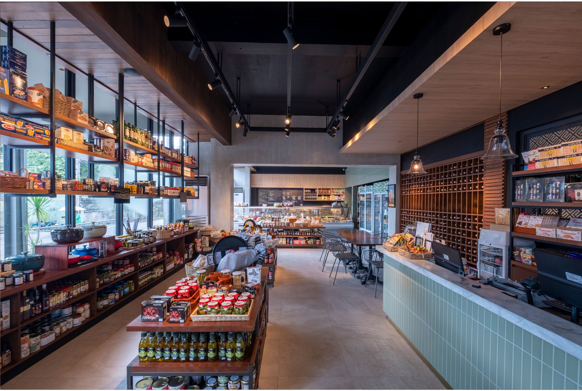 Cafe Bobs Deli designed by Larawan Ink in Bacolod, with shelves packed with goods.