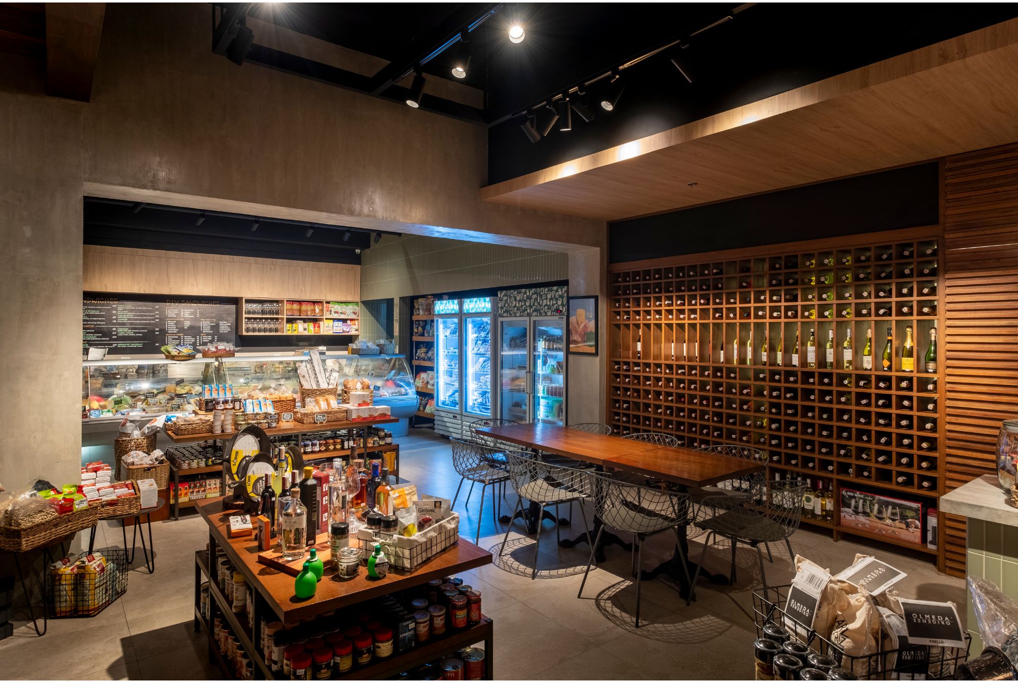 Cafe Bobs Deli designed by Larawan Ink in Bacolod, with shelves packed with goods.