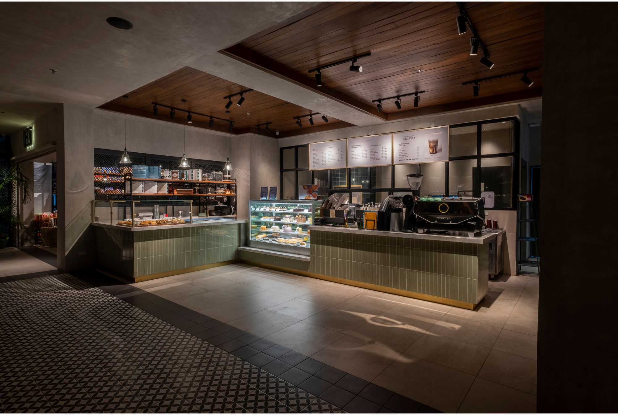 Cafe Bobs coffee shop with ambient lighting and sage green counter.