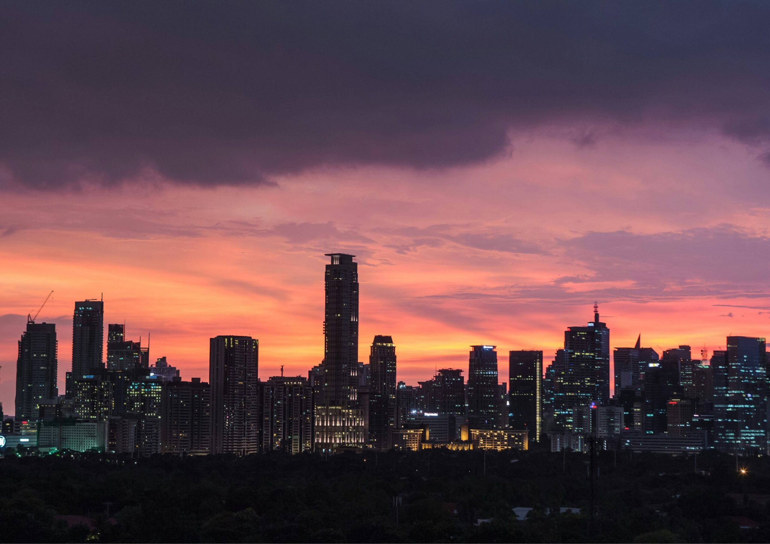 photograph of metro manila skyline at sunset. Photo by Andrey Andreyev on Unsplash.