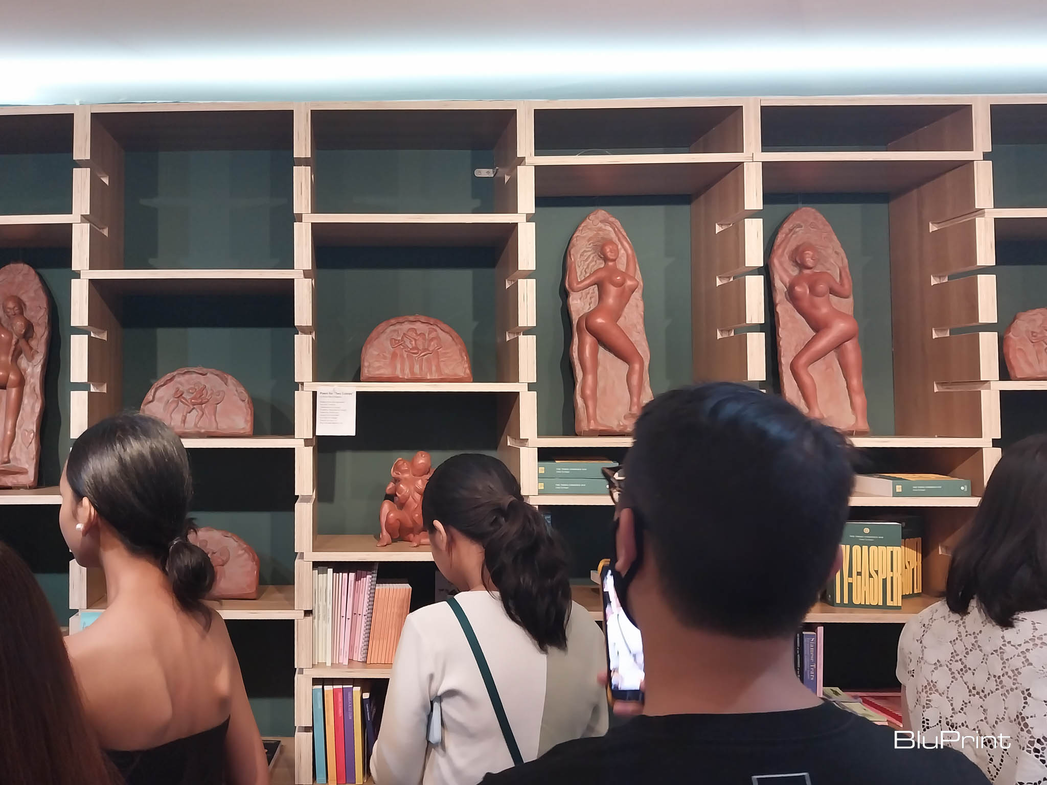 Sculptures as posed in the bookshelves. Photo by Elle F. Yap