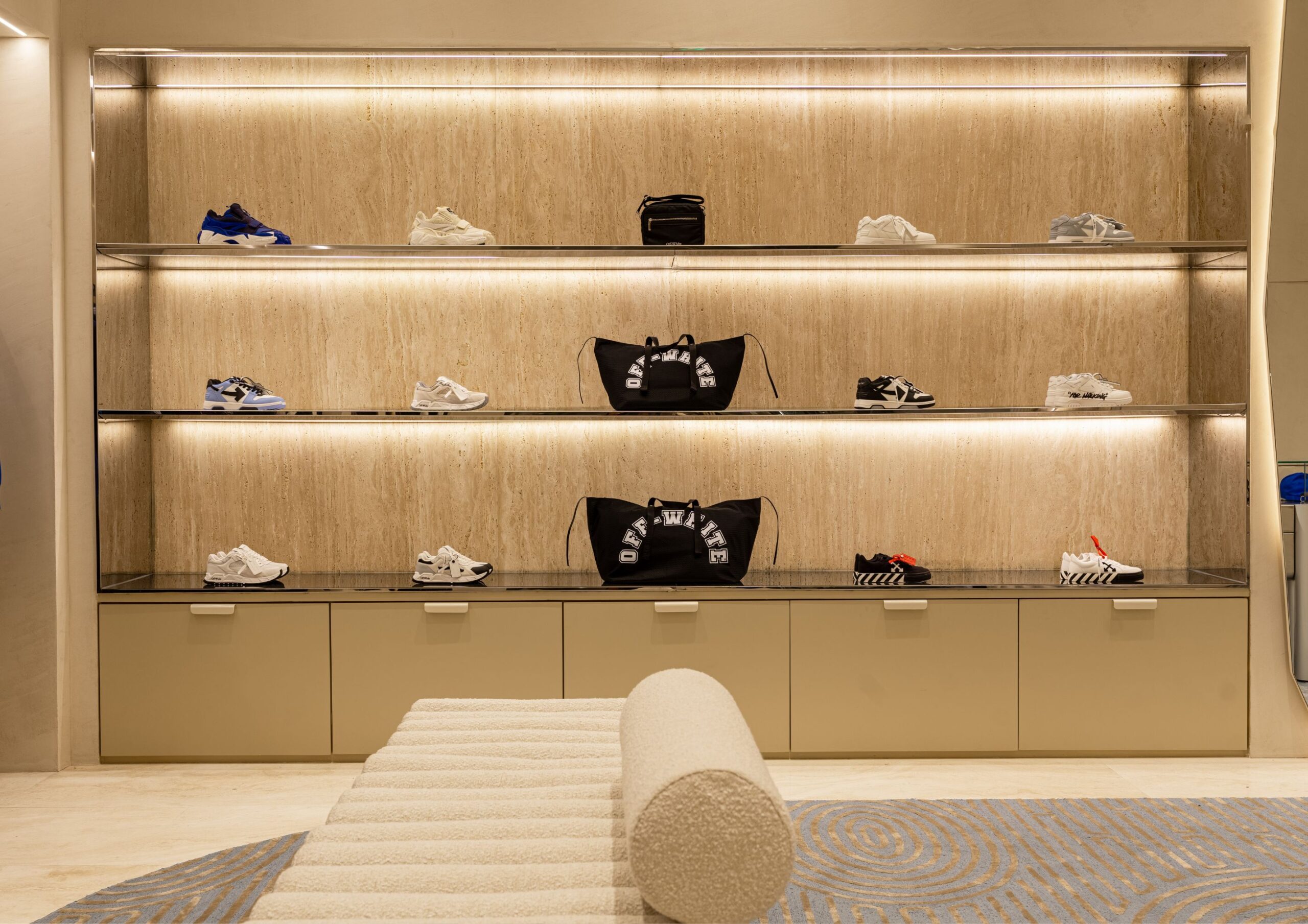 Off White store with minimalist off white interiors and high end designer fashion items.