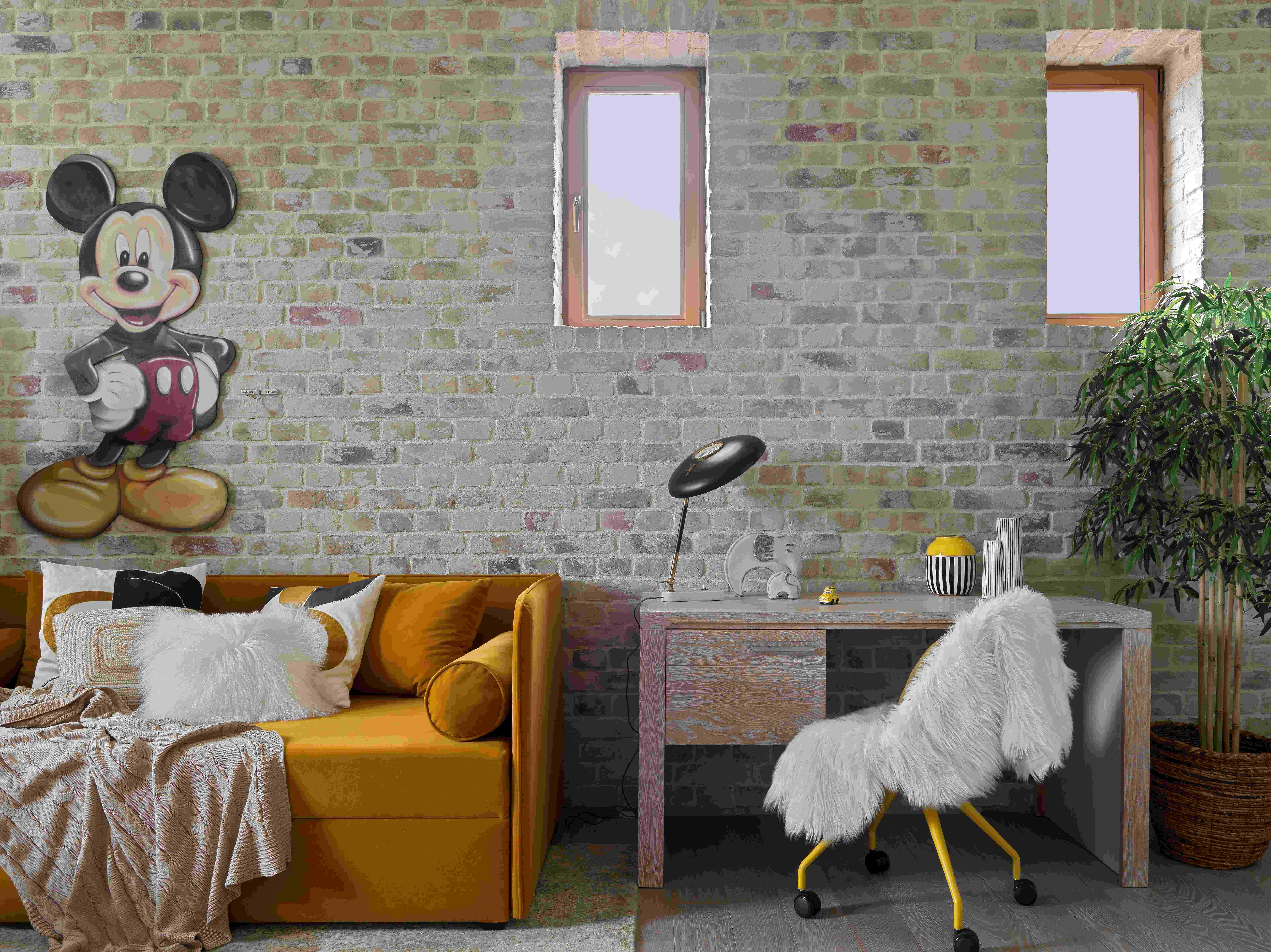 Pestovo House's kid's bedroom with brick accent wall and orange couch.