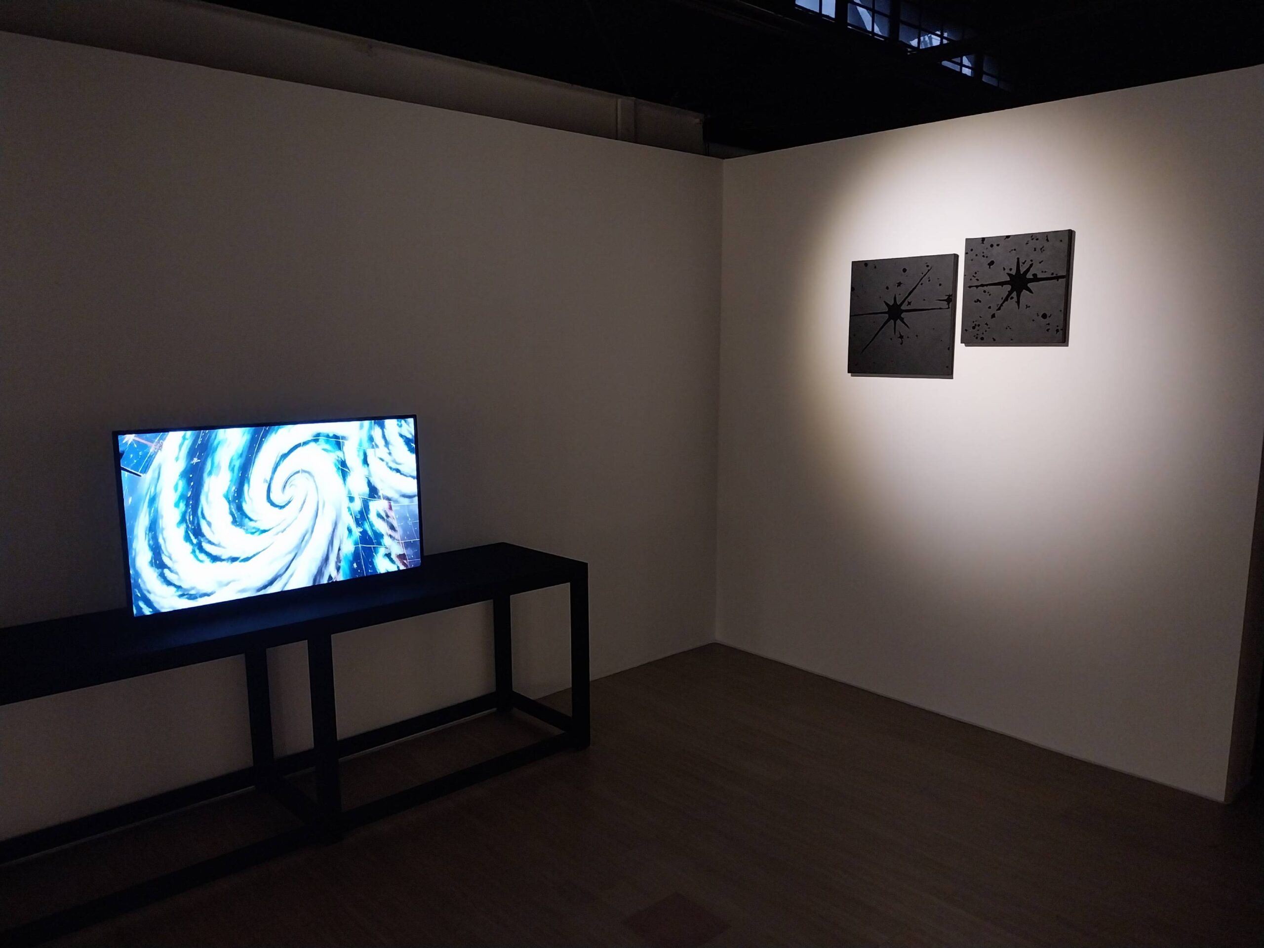 A digital rendition of a storm, next to two of the "Black Paintings." Photo by Elle Yap.