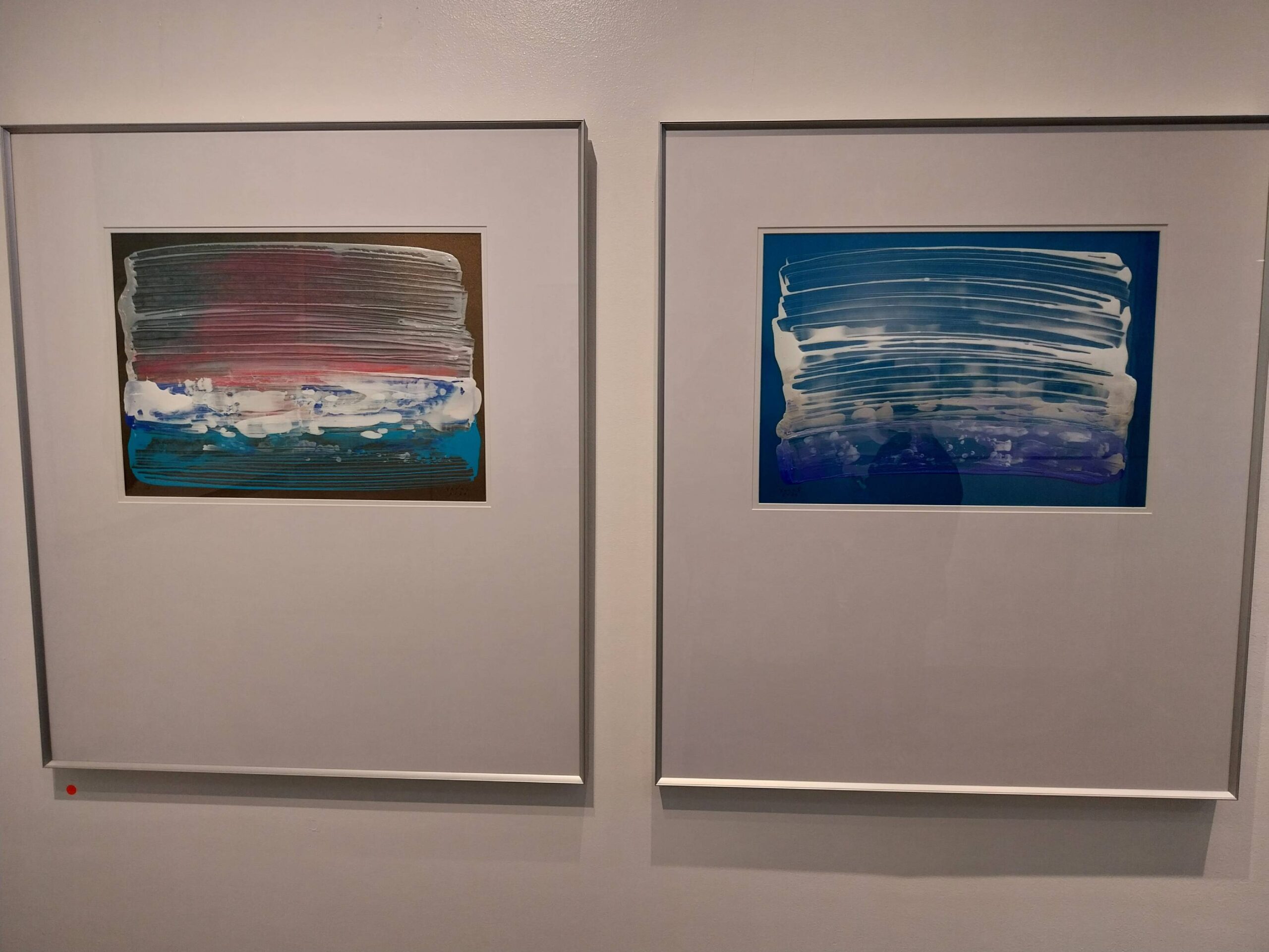 Paintings that were featured in the exhibit. Photo by Elle Yap.