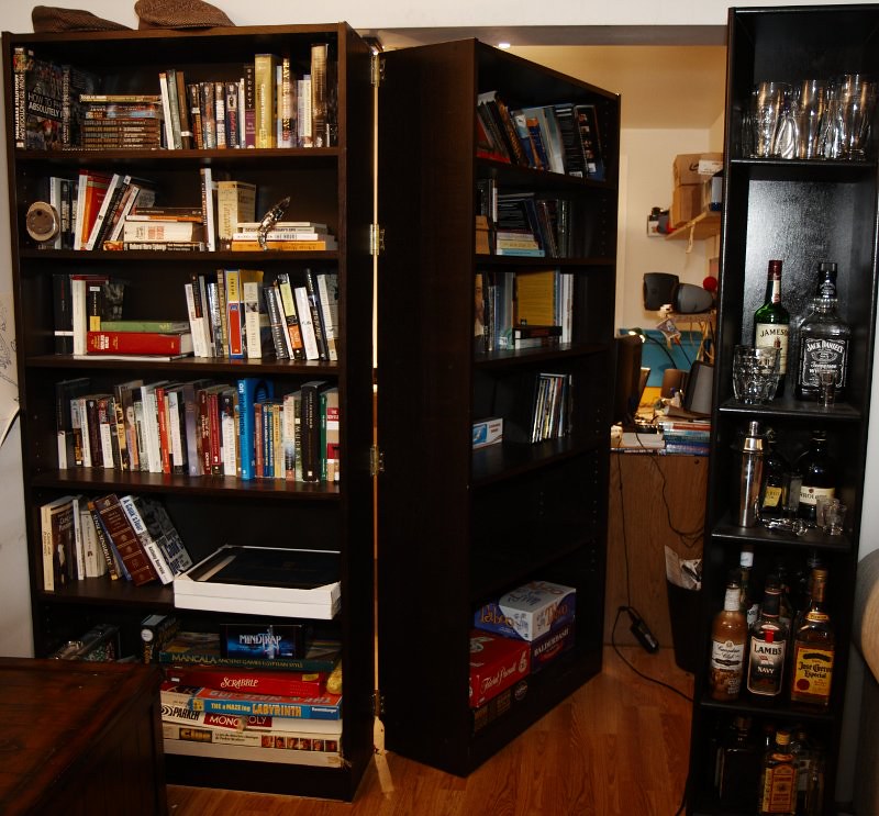 A bookshelf with a secret door compartment. Photo by agmk. Source: Flickr.