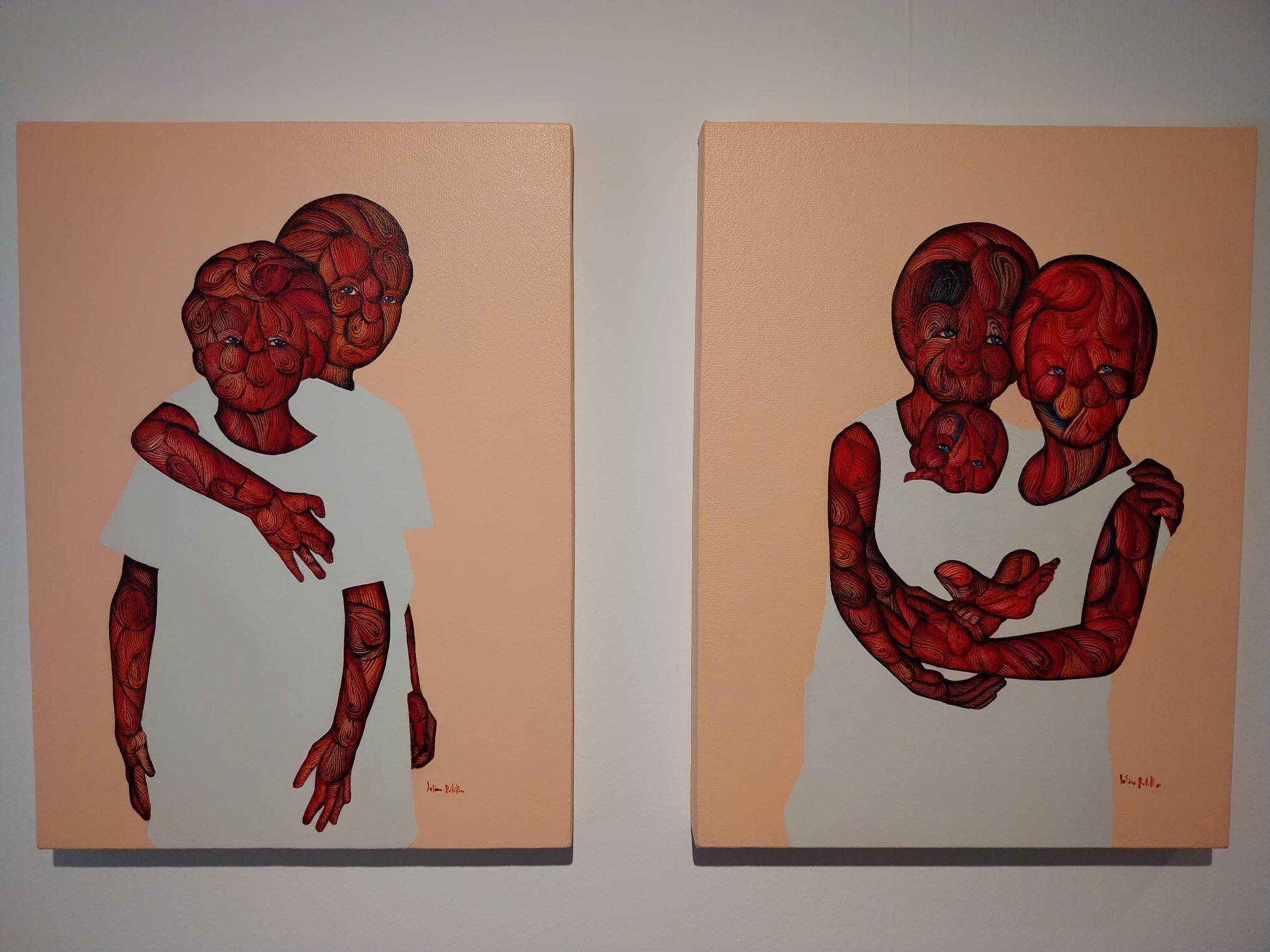 Two paintings by Julius Redillas for "Word on the Street." Photo by Elle Yap.