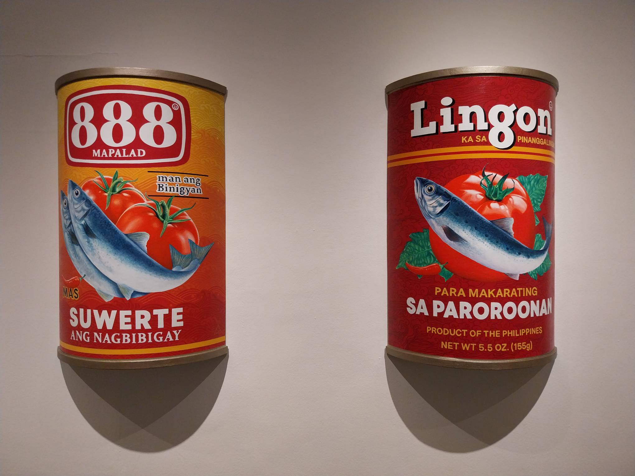 Two artwork parodies in Carlo Tanseco's "Canned Thoughts." Photo by Elle Yap.