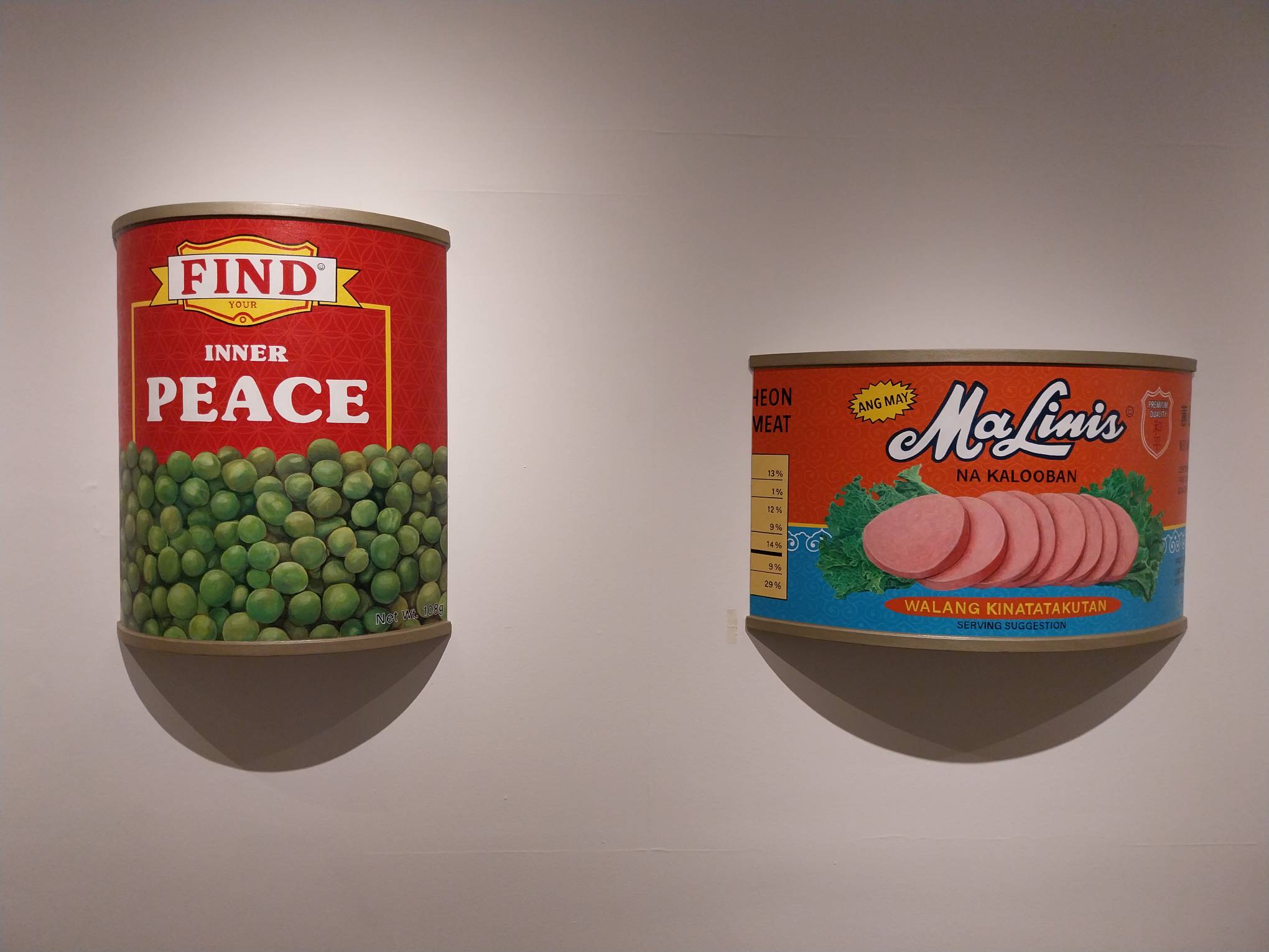 Two artwork parodies in Carlo Tanseco's "Canned Thoughts." Photo by Elle Yap.