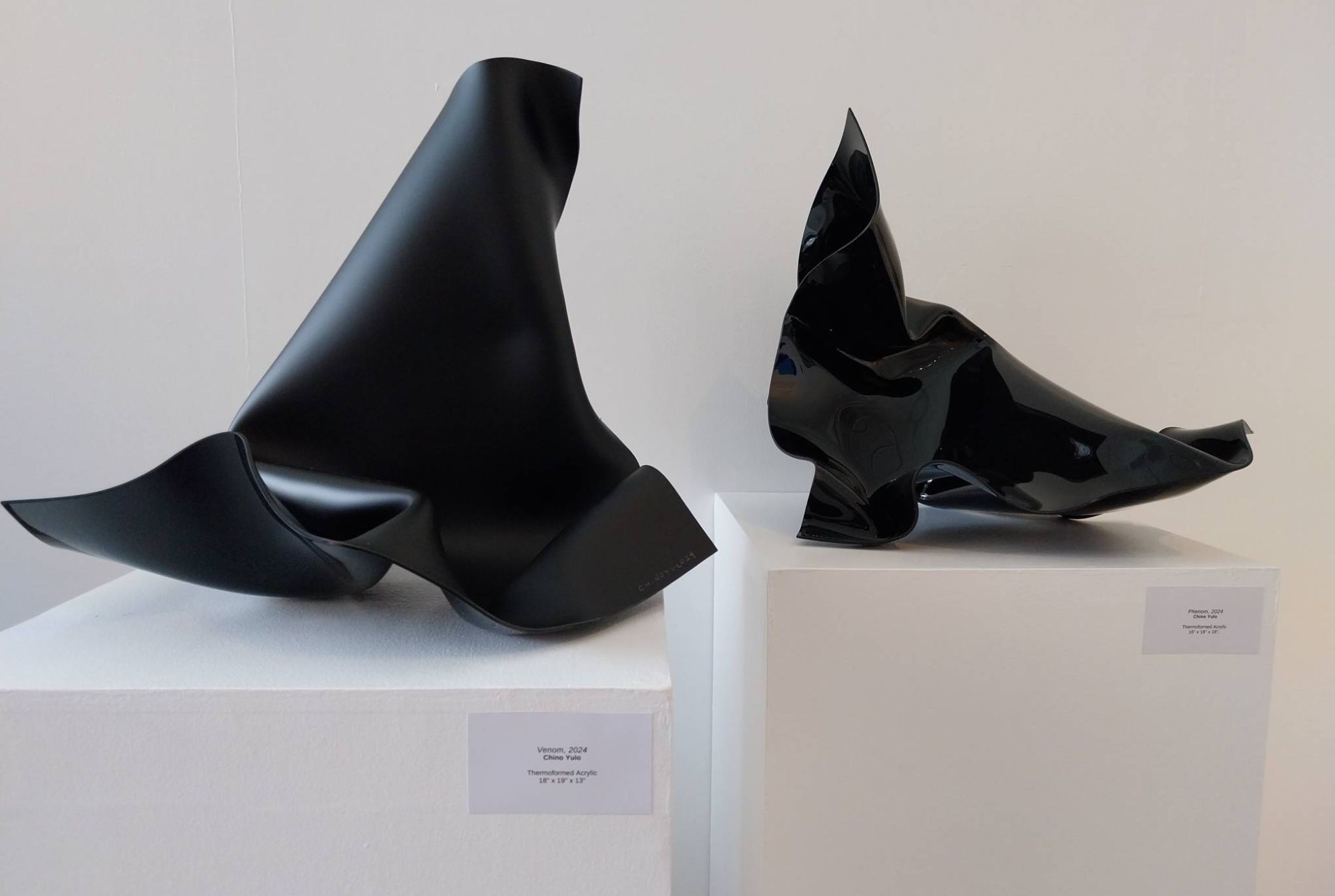Two black sculptures by Chino Yulo in "Be Water." Photo by Elle Yap.