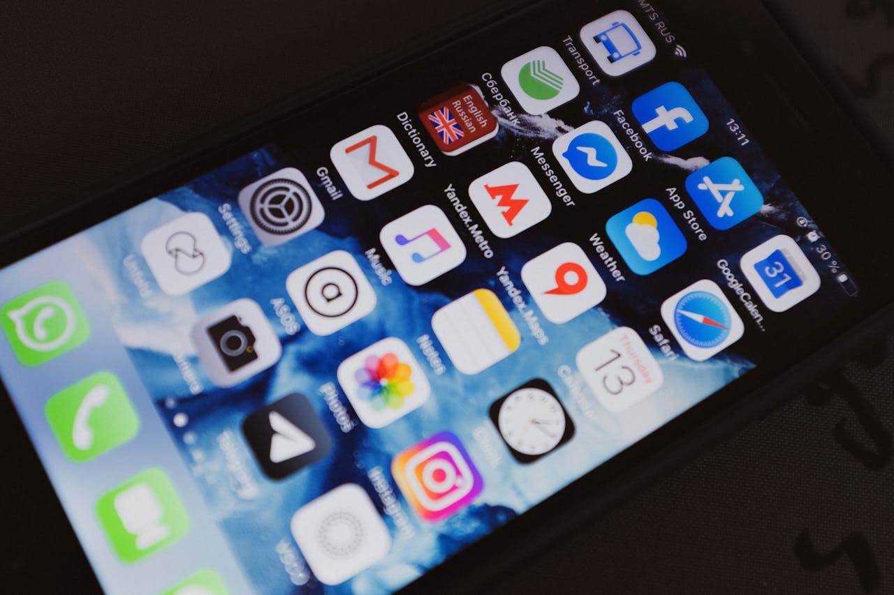 An Apple iPhone filled with apps. Photo by ready made. Source: Pexels.