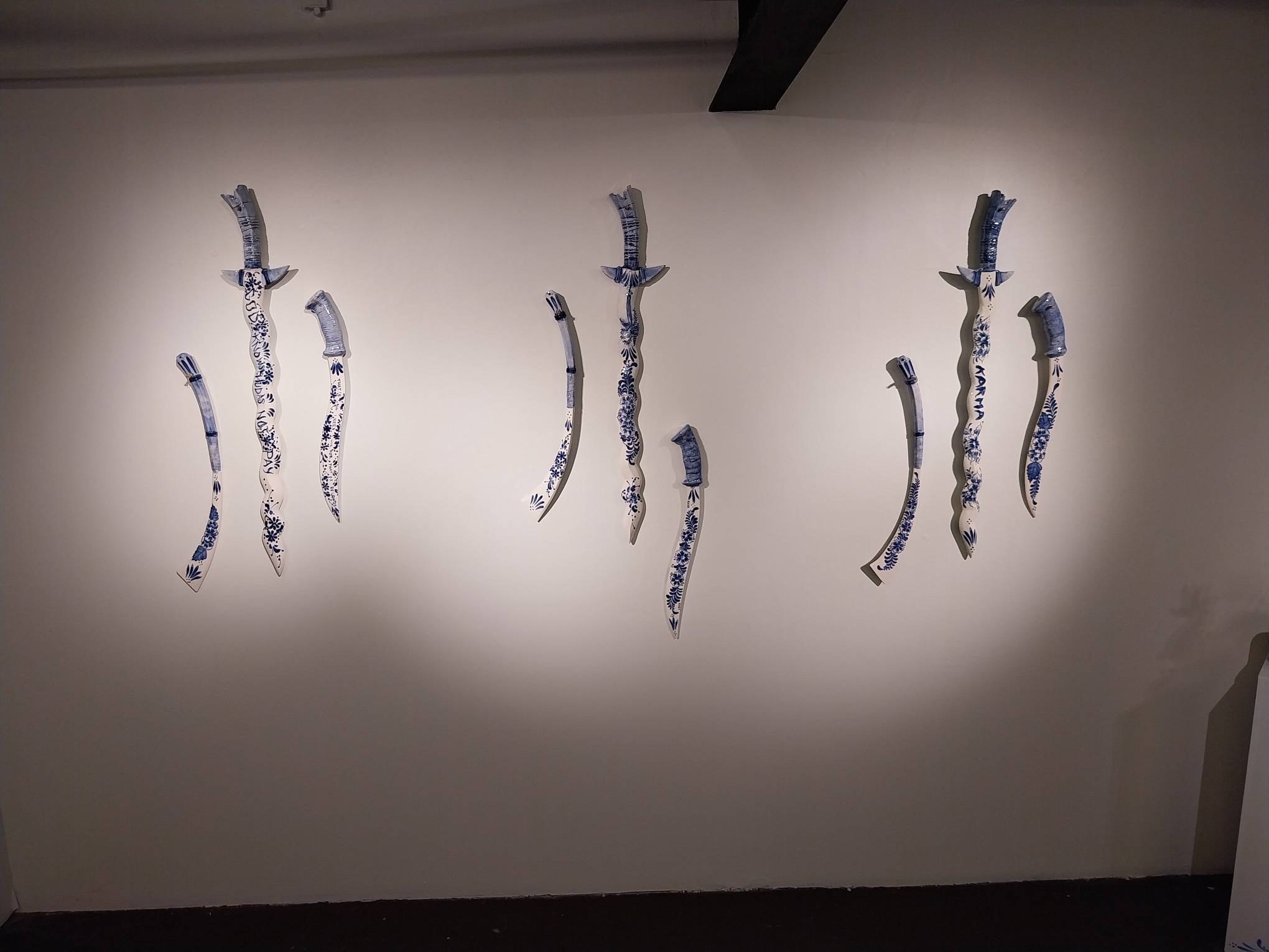Each pairing of three blades, collectively known as "Sandata," as presented in the exhibit. Photo by Elle Yap.