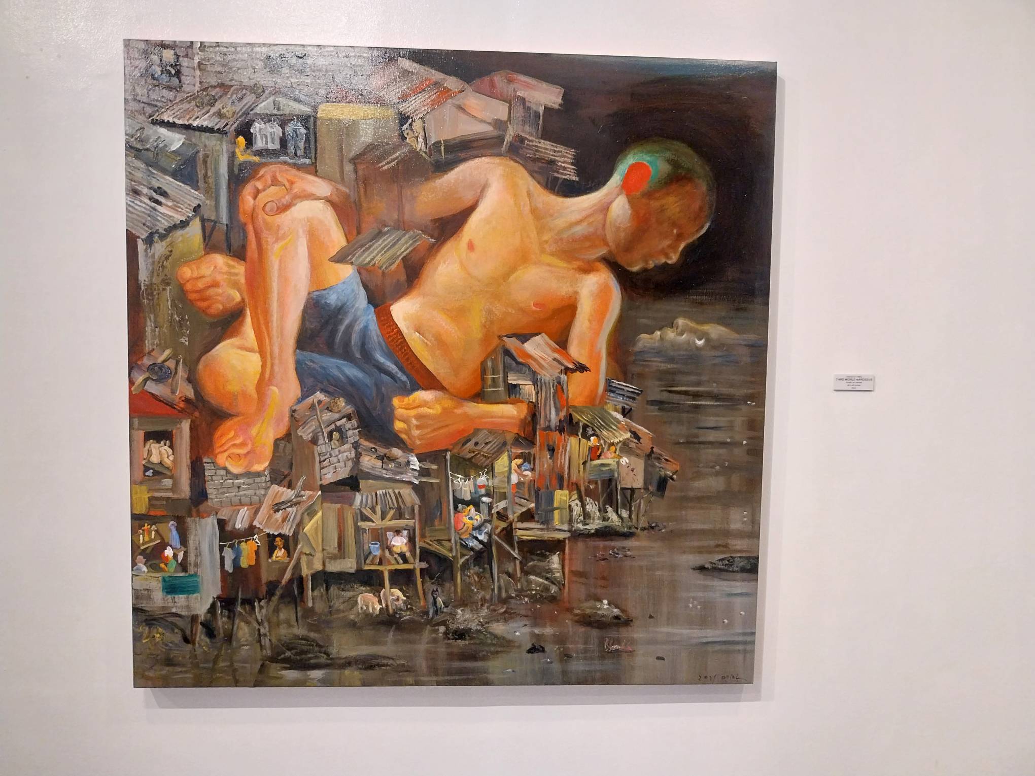 An artwork by Dengcoy Miel showing a giant child. Photo by Elle Yap.