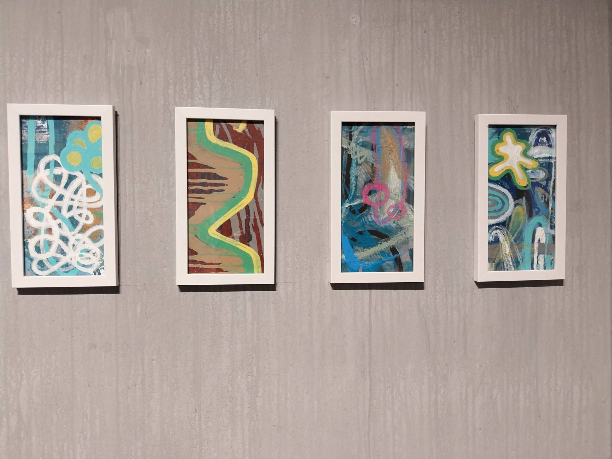 Four of the paintings under the "Rollercoaster" collection by Erwin Teves Pascual. Photo by Elle Yap.