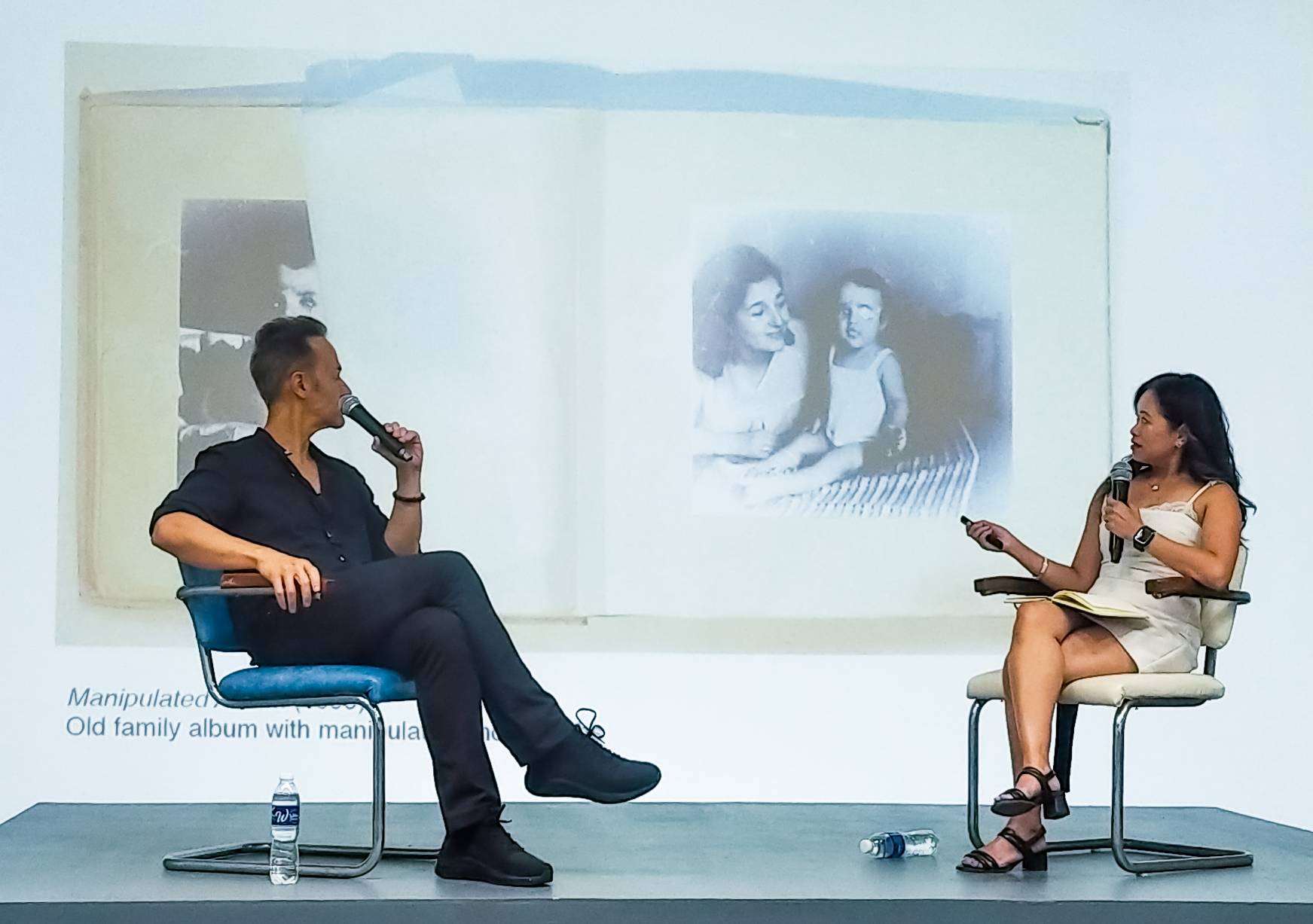 Enrique Marty discussing one of his works with Kristine Guzmán. Photo by Patricia Yap.