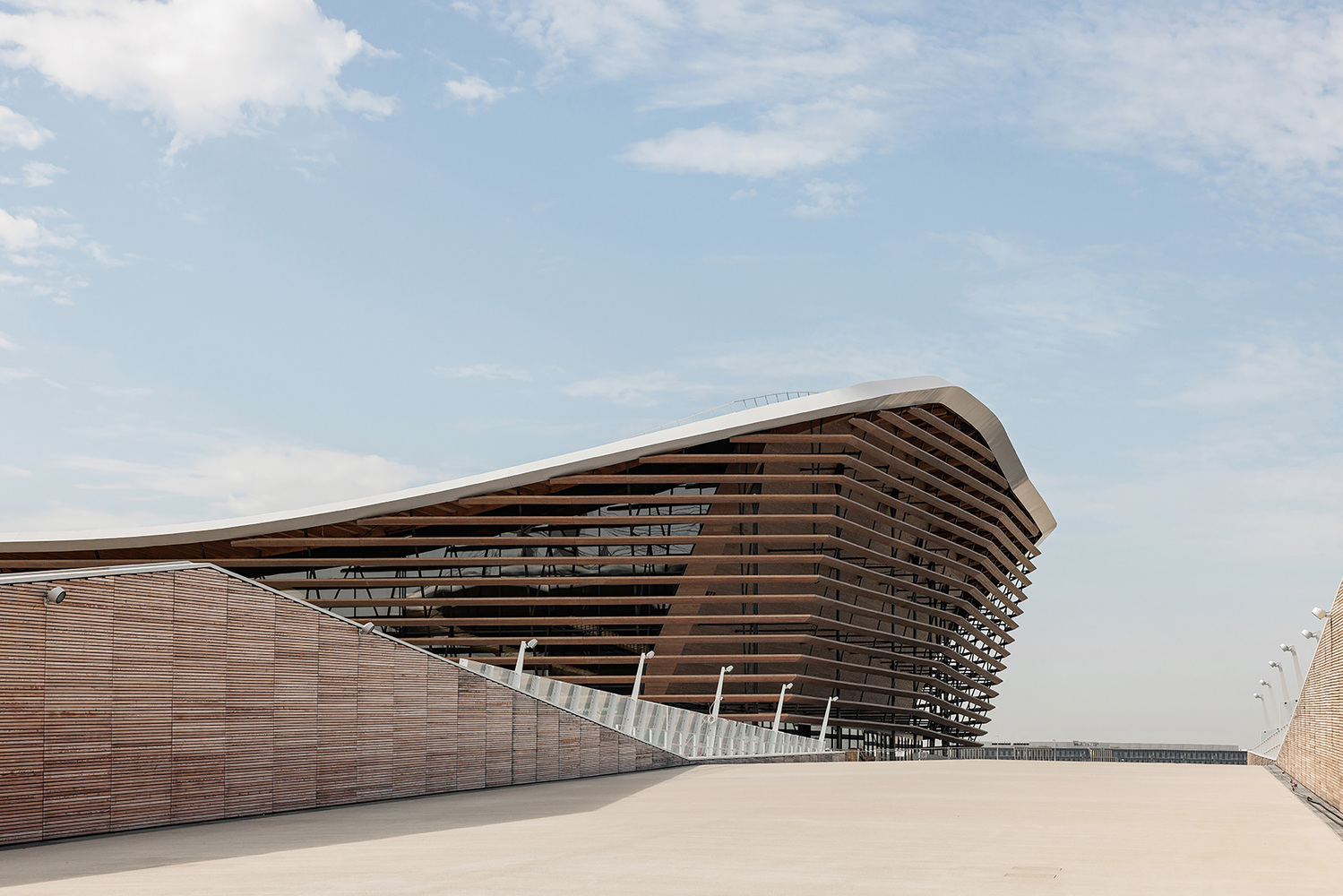 Exterior of the center with its Douglas fir lamellas. Photo by Salem Mostefaoui and Simon Guesdon.