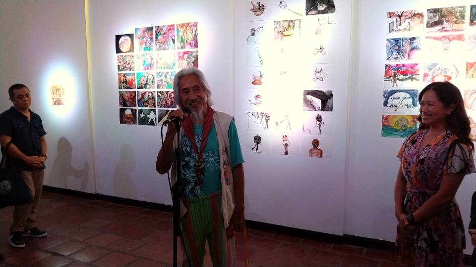 Kidlat Tahimik (center) and curator Kristine Guzman (far right) during the opening of "Wolves at the Door. Cosmic Encounters." by Enrique Marty.