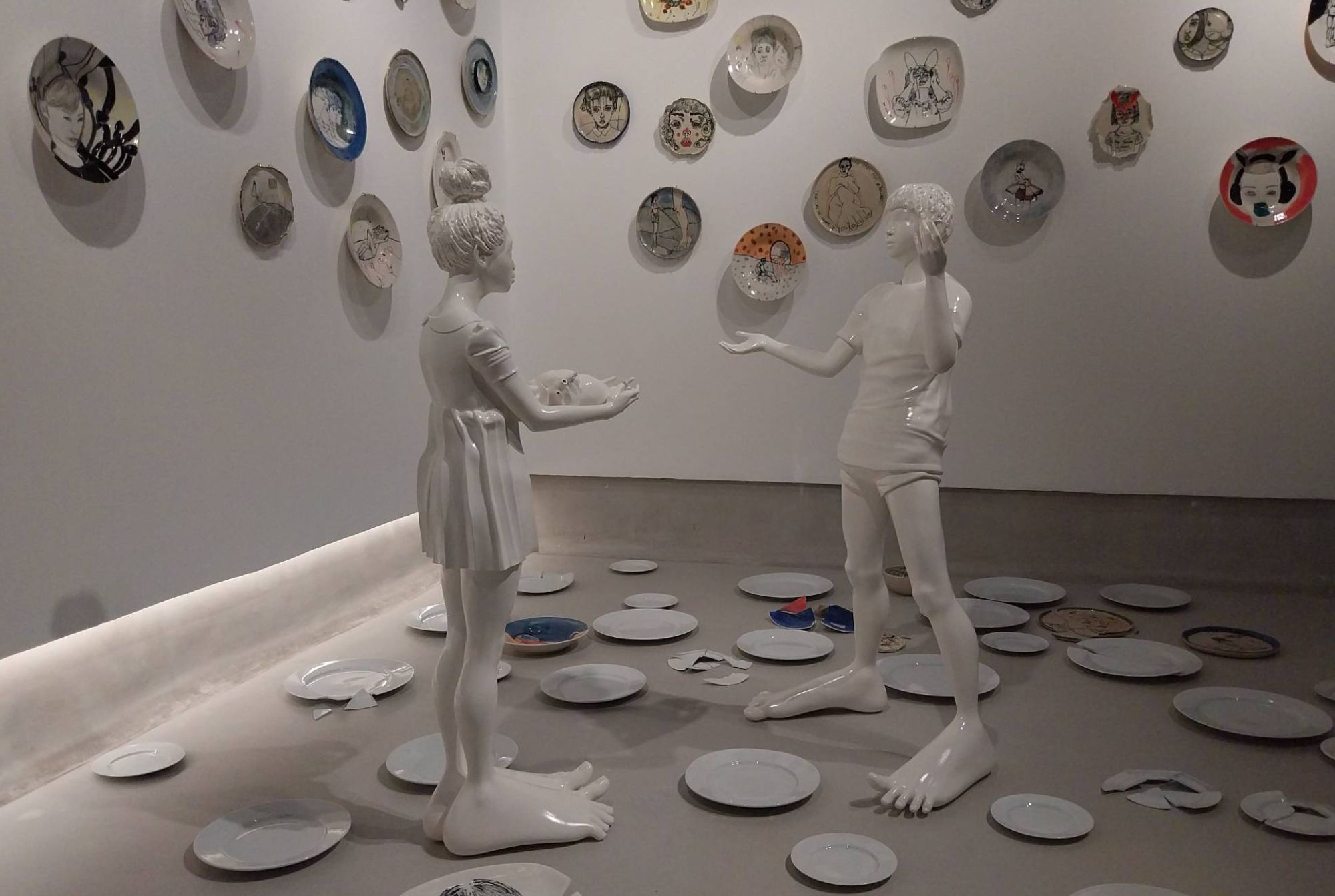 Two porcelain statues as seen in "Breaking to Mend."