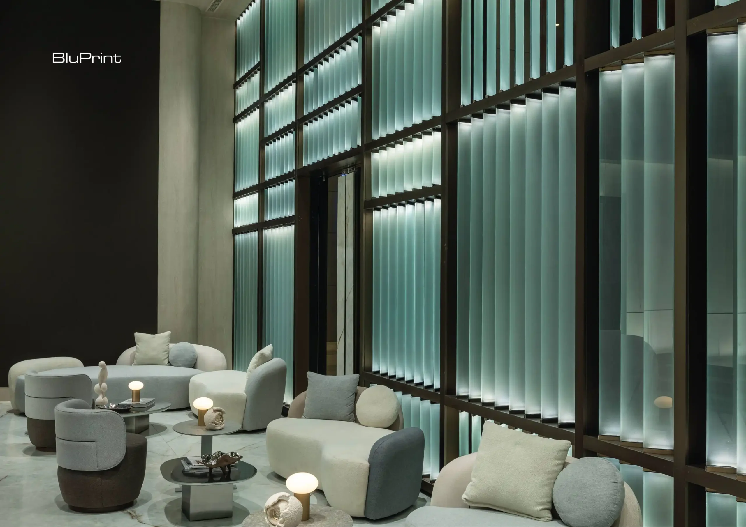 Belo Nexa’s reception area combines a neutral palette, plush seating, and low-profile tables for a refined and inviting ambiance.