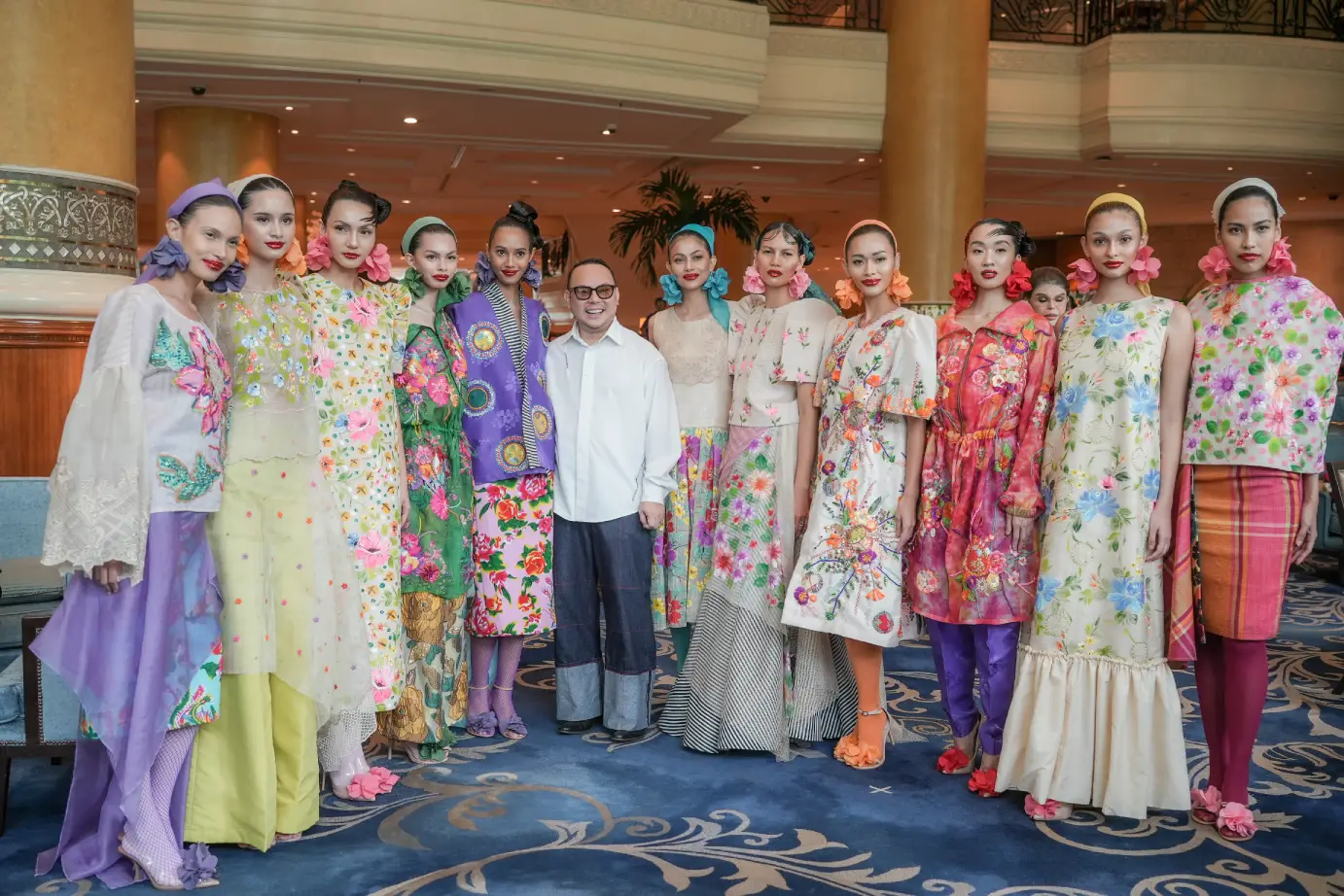 The launch of "Heirloom," with Jor-el Espina surrounded by models showing off his clothes.