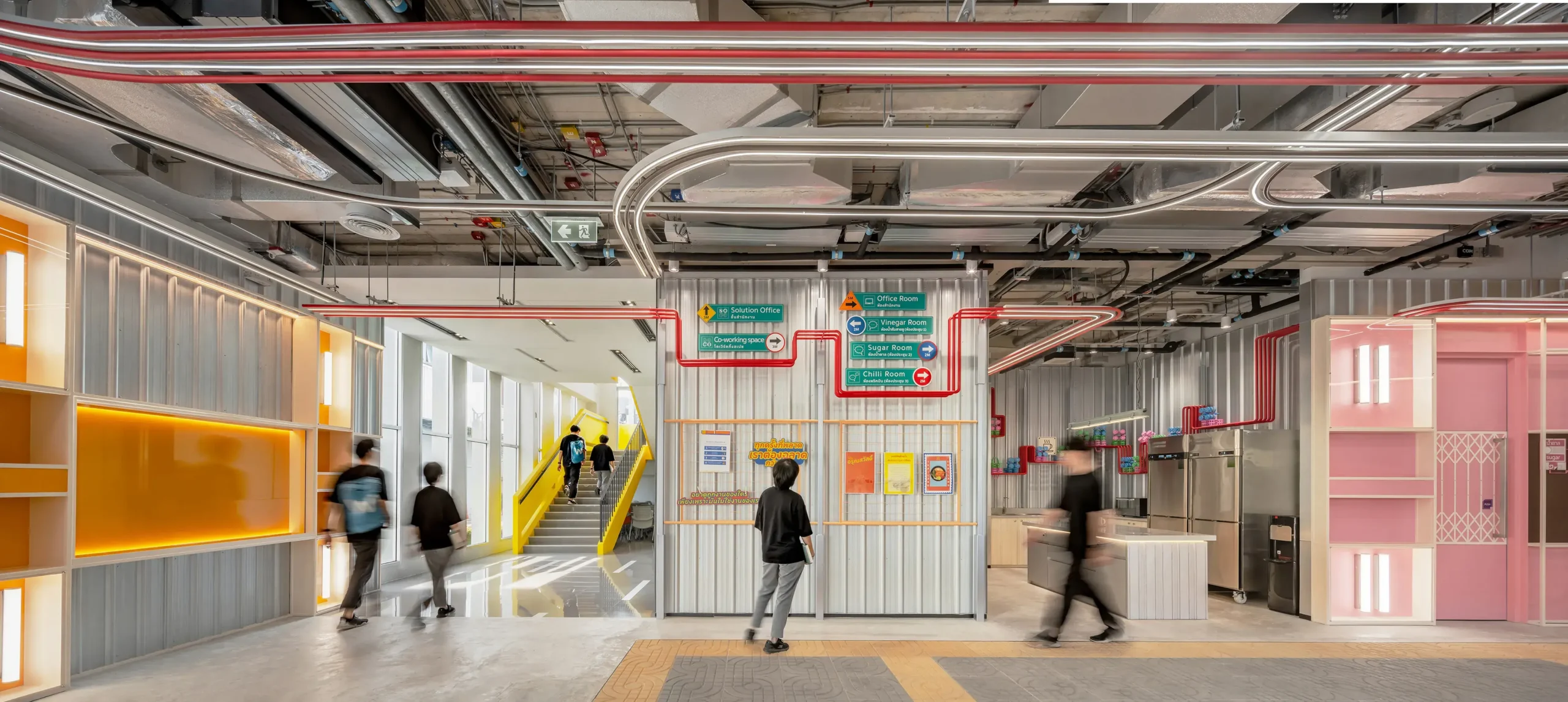 Features often found in Bangkok, such as posters and utility lines, are integrated into the space.