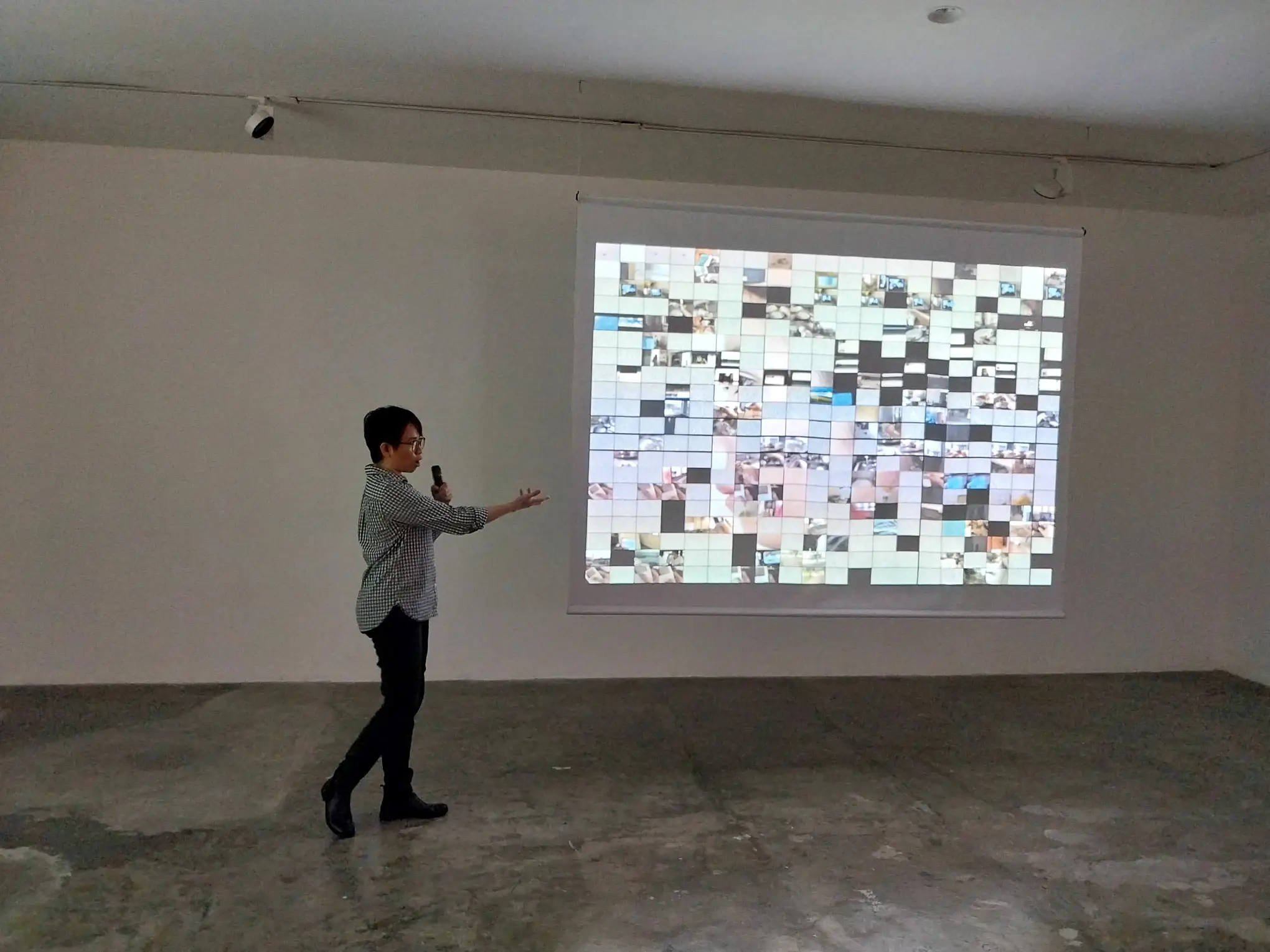 Artist Lee Paje explaining one of her works for "eatsleepdreamwork."