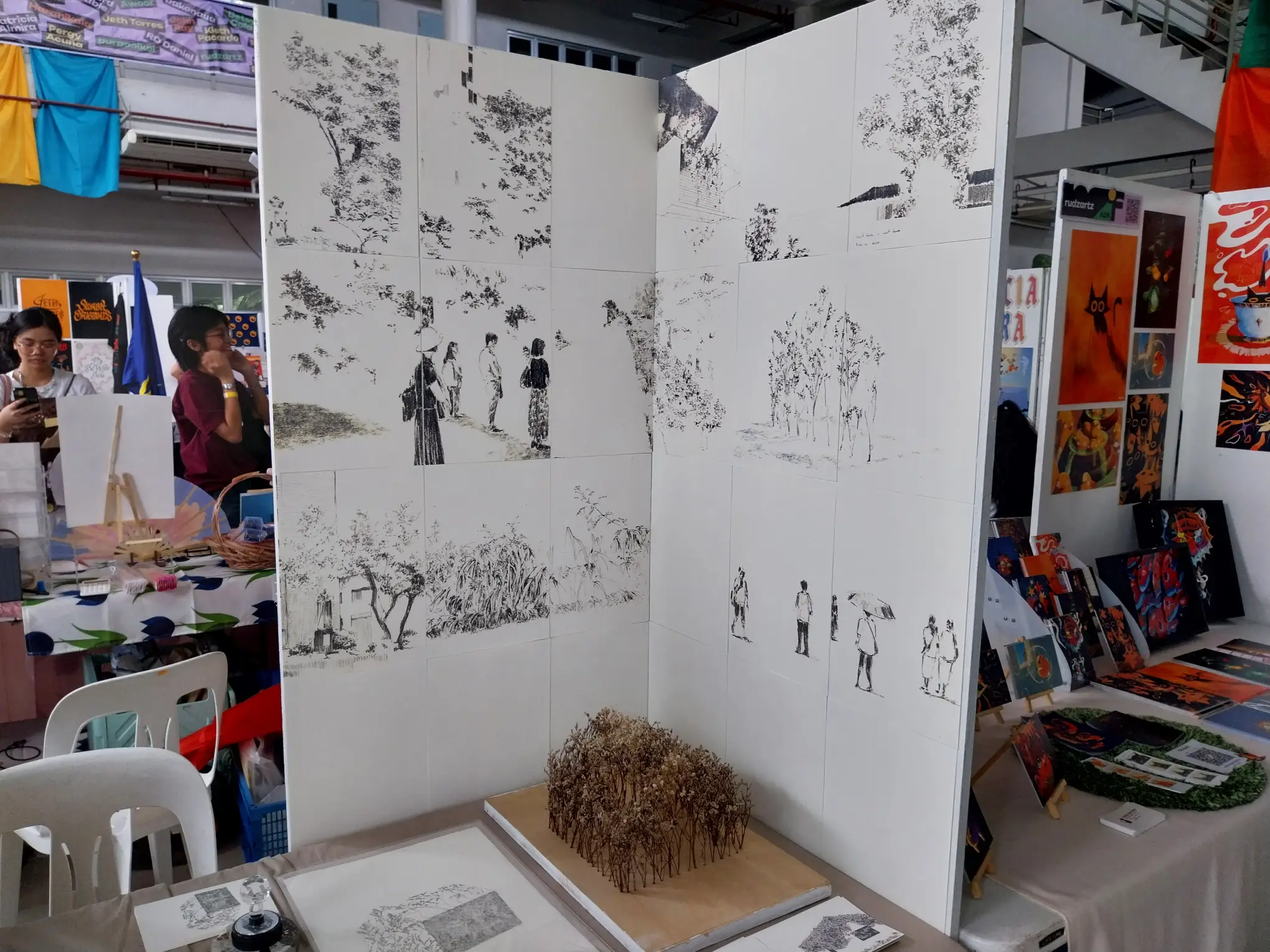 A sketch artist showcasing their sketches.