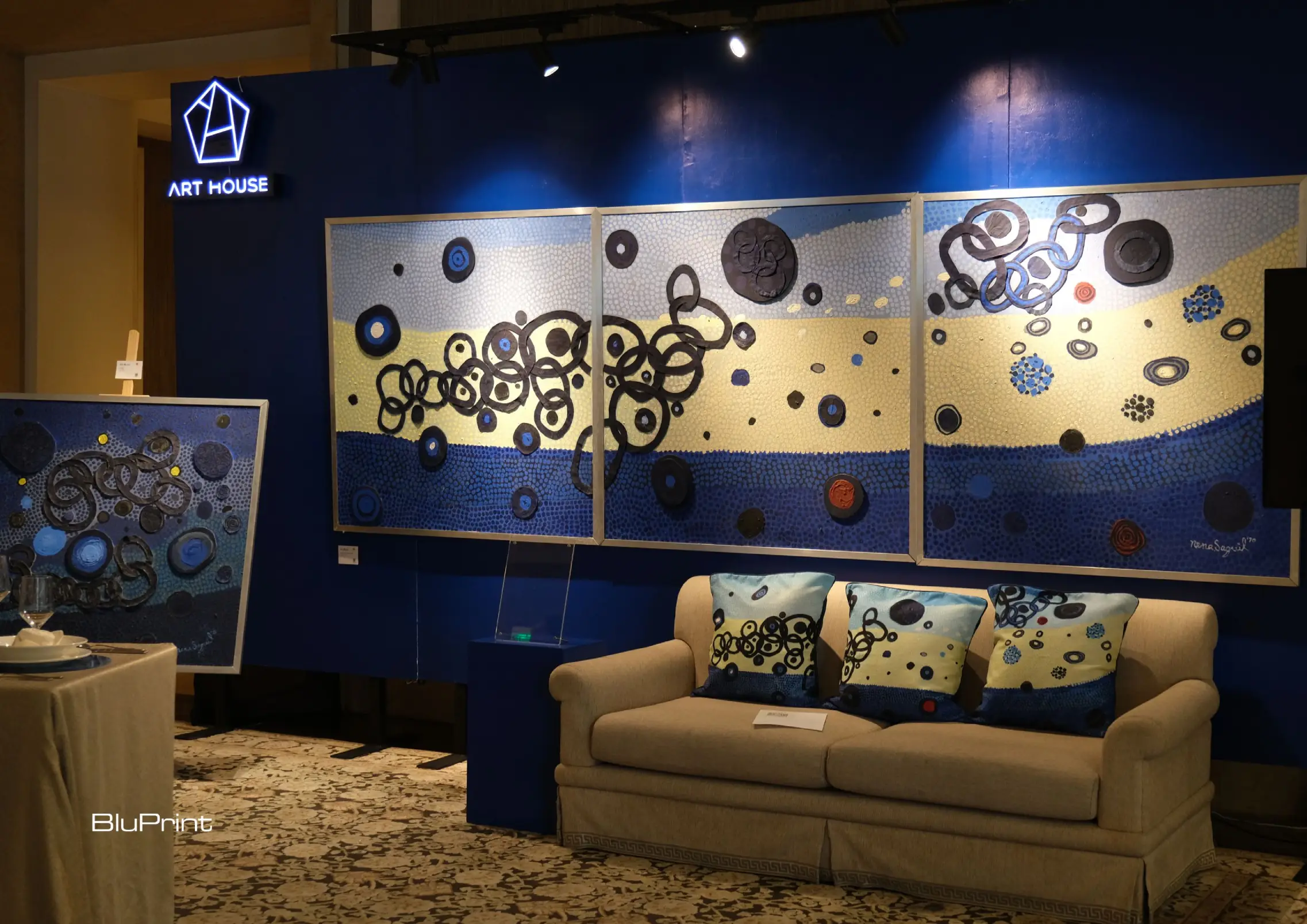 An image featuring the Art House's merchandise of Nena Saguil, and some of her works.